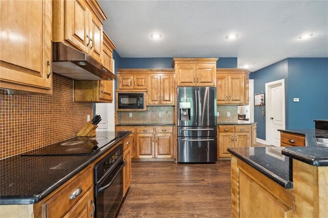 kitchen featuring backsplash, dark wood-style flooring, black appliances, under cabinet range hood, and recessed lighting