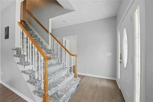 3945 SW Batten Dr, Lees Summit, MO 64082 - entryway featuring wood finished floors, baseboards, and healthy amount of natural light