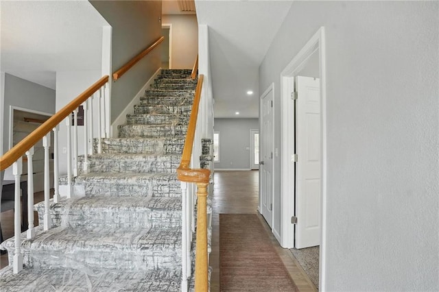 3945 SW Batten Dr, Lees Summit, MO 64082 - staircase with wood finished floors, recessed lighting, and baseboards