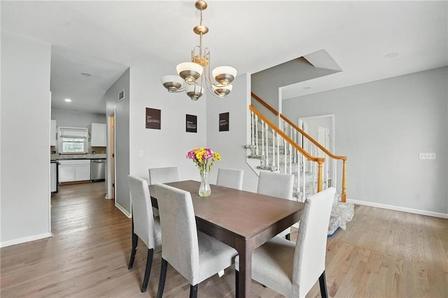 3945 SW Batten Dr, Lees Summit, MO 64082 - dining area featuring a chandelier, light wood-style flooring, stairway, baseboards, and recessed lighting