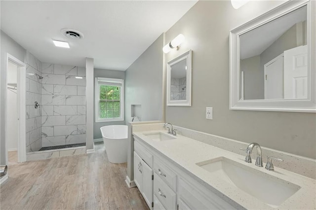 3945 SW Batten Dr, Lees Summit, MO 64082 - full bath with a shower stall, a soaking tub, double vanity, and wood finished floors