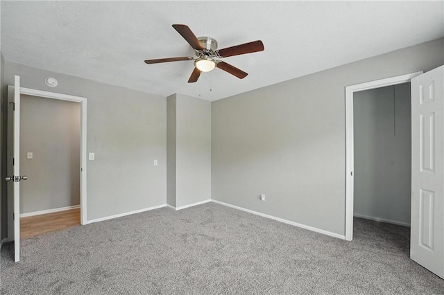 3945 SW Batten Dr, Lees Summit, MO 64082 - unfurnished bedroom featuring carpet floors, baseboards, ceiling fan, and a spacious closet