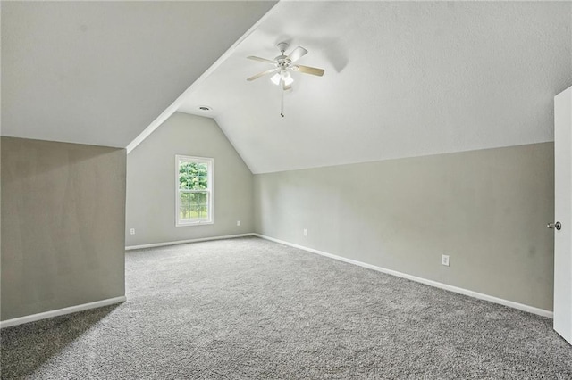 3945 SW Batten Dr, Lees Summit, MO 64082 - bonus room with a ceiling fan, carpet floors, baseboards, and vaulted ceiling