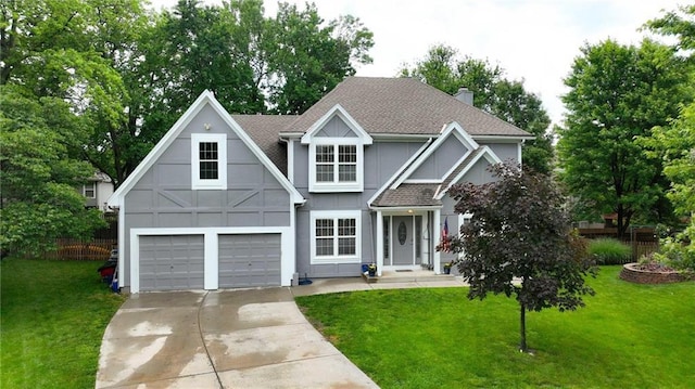 3945 SW Batten Dr, Lees Summit, MO 64082 - view of front of home featuring driveway, stucco siding, a chimney, roof with shingles, and a garage