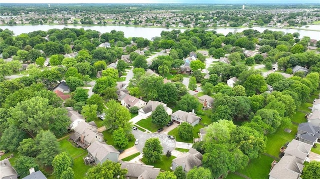 3945 SW Batten Dr, Lees Summit, MO 64082 - aerial view of residential area featuring a nearby body of water and a tree filled landscape