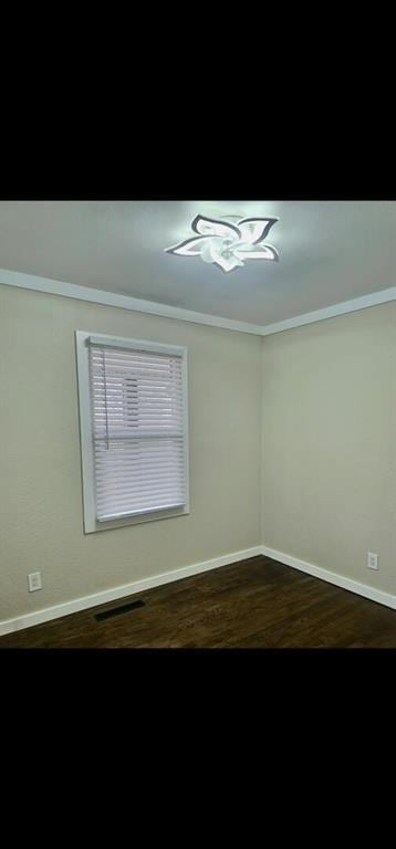 11115 E 35th Ter S, Independence, MO 64052 - unfurnished room featuring baseboards and dark wood finished floors