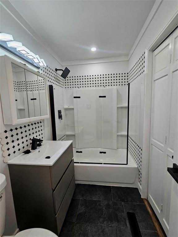 11115 E 35th Ter S, Independence, MO 64052 - full bathroom with toilet, vanity, and tile patterned floors