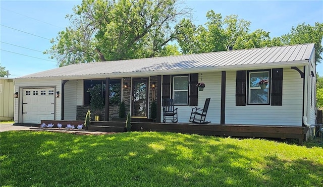 11115 E 35th Ter S, Independence, MO 64052 - ranch-style house with a garage, a porch, a front lawn, driveway, and metal roof