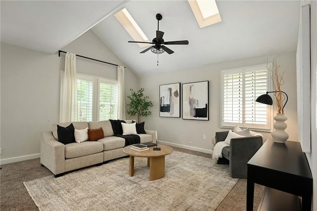 2616 W 47th Ter, Westwood, KS 66205 - carpeted living room featuring a skylight, lofted ceiling, and a ceiling fan
