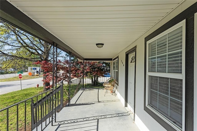 206 SW 22nd St, Blue Springs, MO 64015 - view of patio / terrace featuring a porch