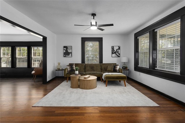 206 SW 22nd St, Blue Springs, MO 64015 - living area with baseboards, wood finished floors, and ceiling fan