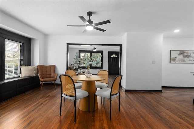 206 SW 22nd St, Blue Springs, MO 64015 - dining area with a ceiling fan, baseboards, and dark wood-type flooring