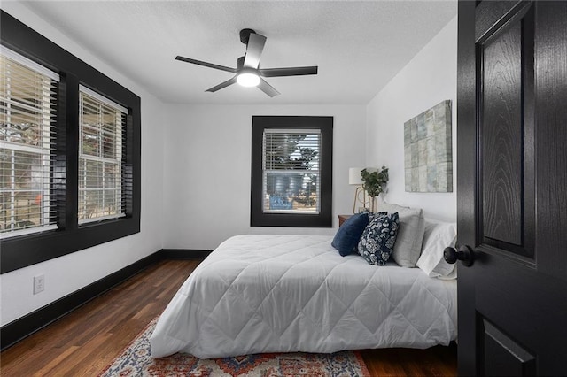 206 SW 22nd St, Blue Springs, MO 64015 - bedroom featuring a ceiling fan, baseboards, and dark wood-type flooring