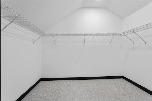 206 SW 22nd St, Blue Springs, MO 64015 - spacious closet featuring lofted ceiling and carpet