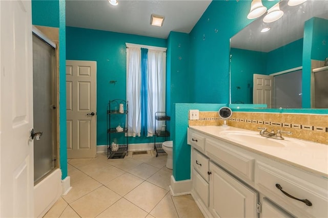 full bath featuring baseboards, tile patterned flooring, vanity, and toilet