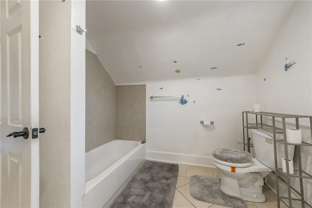 full bathroom with baseboards, lofted ceiling, tile patterned floors, and toilet