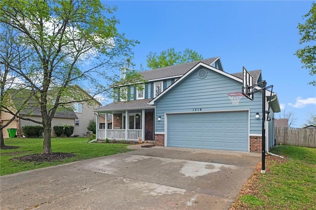 traditional-style home with brick siding, a front lawn, an attached garage, and covered porch