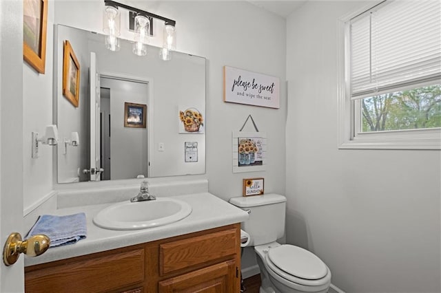 bathroom with toilet and vanity