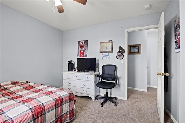 bedroom featuring baseboards, light carpet, and ceiling fan