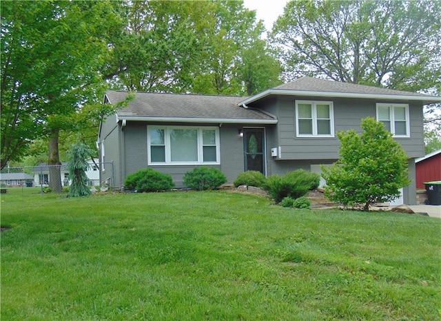 1803 Bird Ter, Harrisonville, MO 64701 - split level home featuring a front lawn and fence