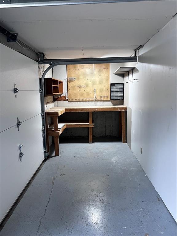 1803 Bird Ter, Harrisonville, MO 64701 - garage featuring a workshop area