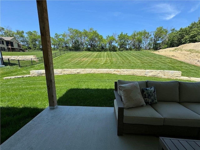 view of yard featuring an outdoor hangout area, a patio, and fence
