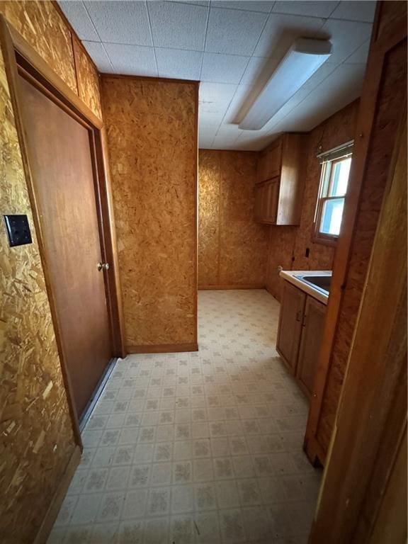 915 W 4th St, Chanute, KS 66720 - kitchen with brown cabinets and light flooring