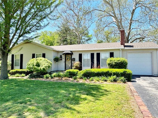 610 S Woodland St, Pittsburg, KS 66762 - single story home featuring an attached garage, a chimney, a front lawn, and driveway