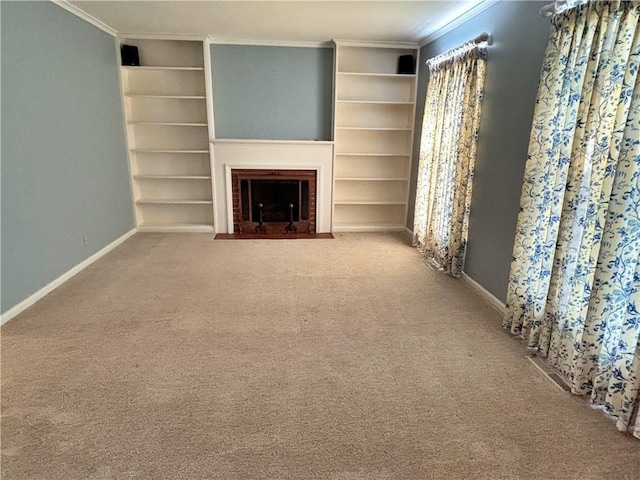 610 S Woodland St, Pittsburg, KS 66762 - unfurnished living room with a fireplace, crown molding, baseboards, carpet, and built in shelves