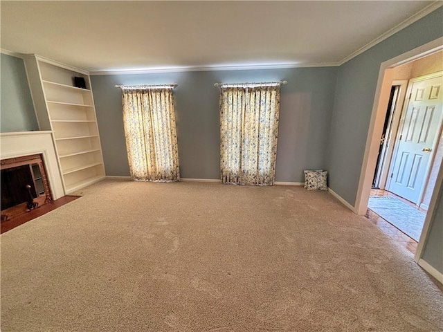 610 S Woodland St, Pittsburg, KS 66762 - unfurnished living room with crown molding, carpet flooring, a fireplace with flush hearth, and baseboards