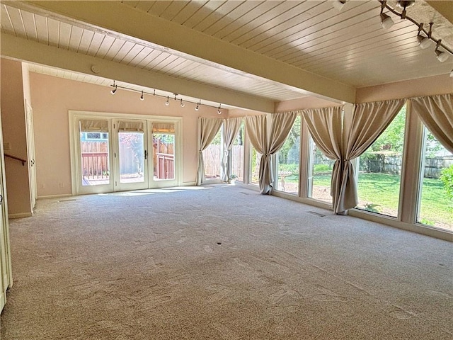 610 S Woodland St, Pittsburg, KS 66762 - carpeted spare room featuring beam ceiling, wood ceiling, and track lighting