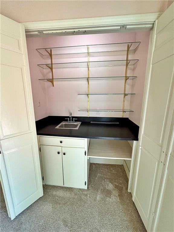 610 S Woodland St, Pittsburg, KS 66762 - washroom with light colored carpet and wet bar