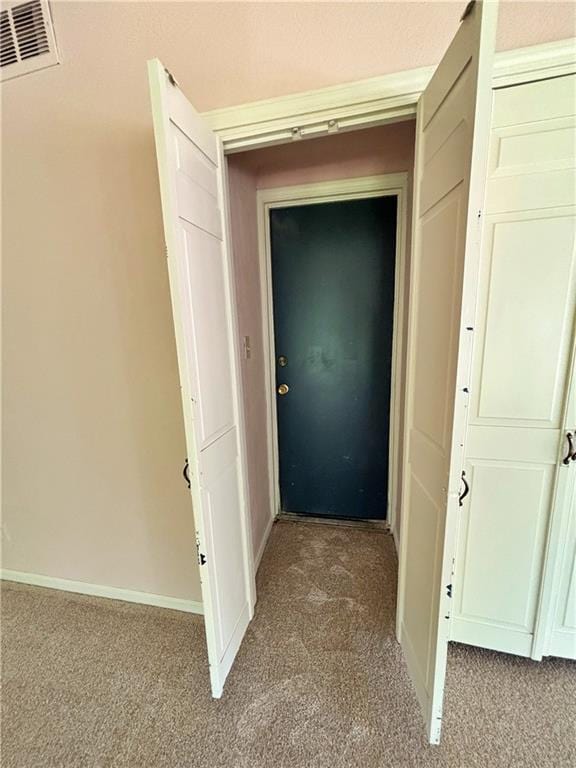 610 S Woodland St, Pittsburg, KS 66762 - corridor with light carpet and baseboards