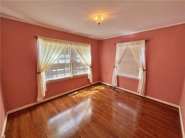 610 S Woodland St, Pittsburg, KS 66762 - unfurnished room featuring wood finished floors, baseboards, and ornamental molding