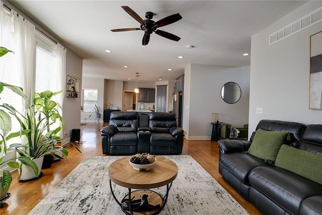 1008 SW Whippoorwill Ln, Oak Grove, MO 64075 - living room featuring ceiling fan, wood finished floors, and recessed lighting