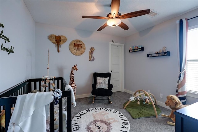 1008 SW Whippoorwill Ln, Oak Grove, MO 64075 - carpeted bedroom featuring a crib and ceiling fan