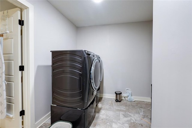 1008 SW Whippoorwill Ln, Oak Grove, MO 64075 - washroom with washing machine and dryer and stone finish floors