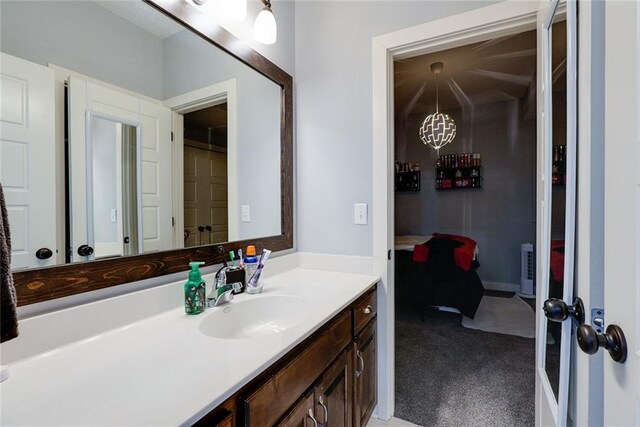 1008 SW Whippoorwill Ln, Oak Grove, MO 64075 - bathroom featuring vanity and a chandelier