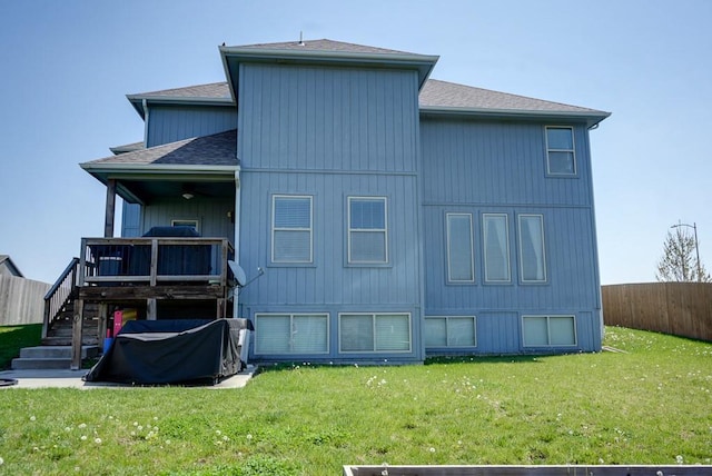 1008 SW Whippoorwill Ln, Oak Grove, MO 64075 - rear view of property with roof with shingles, stairway, and a deck