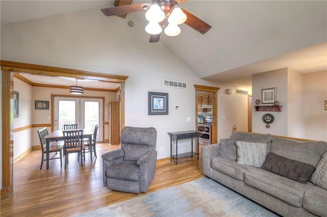 12448 NW Blackwood Dr, Adrian, MO 64720 - living area featuring high vaulted ceiling, a ceiling fan, wood finished floors, baseboards, and visible vents