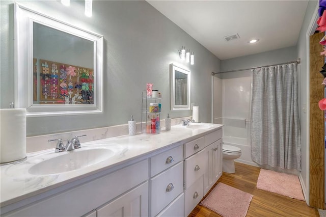 12448 NW Blackwood Dr, Adrian, MO 64720 - full bathroom with shower / bath combo with shower curtain, wood finished floors, a sink, and double vanity