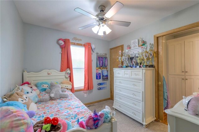 12448 NW Blackwood Dr, Adrian, MO 64720 - bedroom with ceiling fan, baseboards, and light carpet
