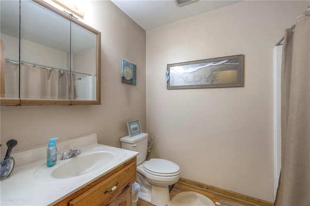 12448 NW Blackwood Dr, Adrian, MO 64720 - full bathroom featuring vanity, a shower with shower curtain, and toilet