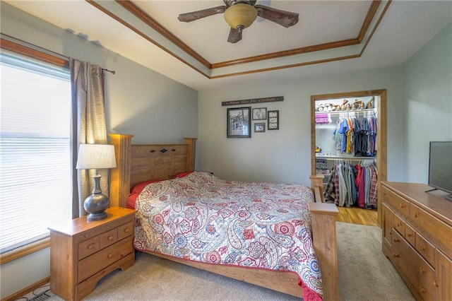 12448 NW Blackwood Dr, Adrian, MO 64720 - bedroom featuring a ceiling fan, crown molding, a closet, a walk in closet, and a raised ceiling