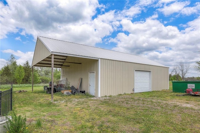 12448 NW Blackwood Dr, Adrian, MO 64720 - view of pole building featuring a yard and fence