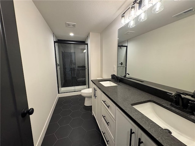 full bathroom with visible vents, toilet, and a sink