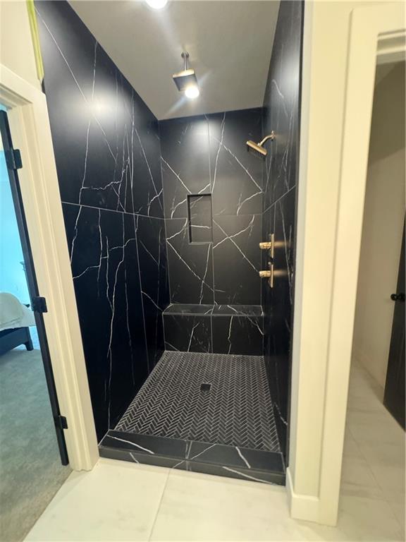 full bathroom with walk in shower and tile patterned floors