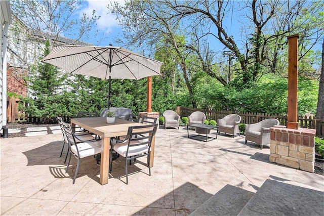 view of patio / terrace featuring a fenced backyard and outdoor dining area