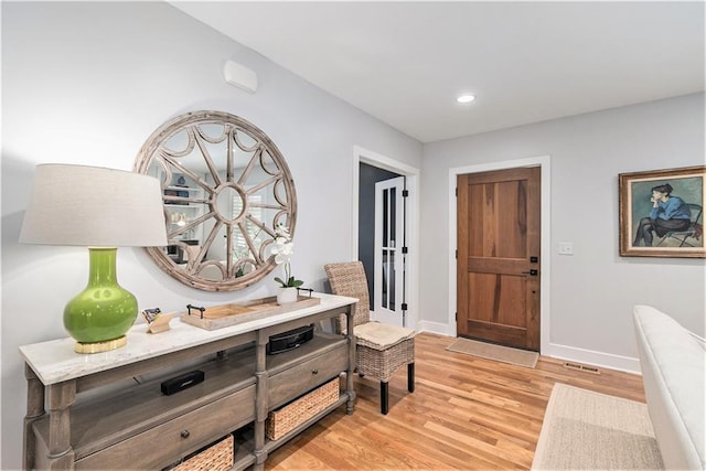 entrance foyer featuring light wood-type flooring, recessed lighting, baseboards, and visible vents