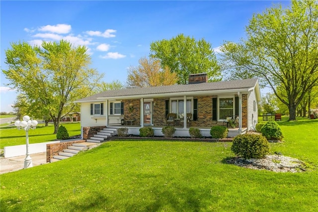 2931 N Washington St, Chillicothe, MO 64601 - single story home with a chimney, a front lawn, brick siding, and covered porch